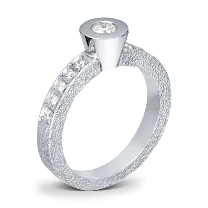 9 9386 H modell Van Bergen - Circle ring i hvitt gull med 1 x 0,20 ct og 10 x 0,02 ct diamanter TWSI Van Bergen - Circle ring i hvitt gull med 1 x 0,20 ct og 10 x 0,02 ct diamanter TWSI